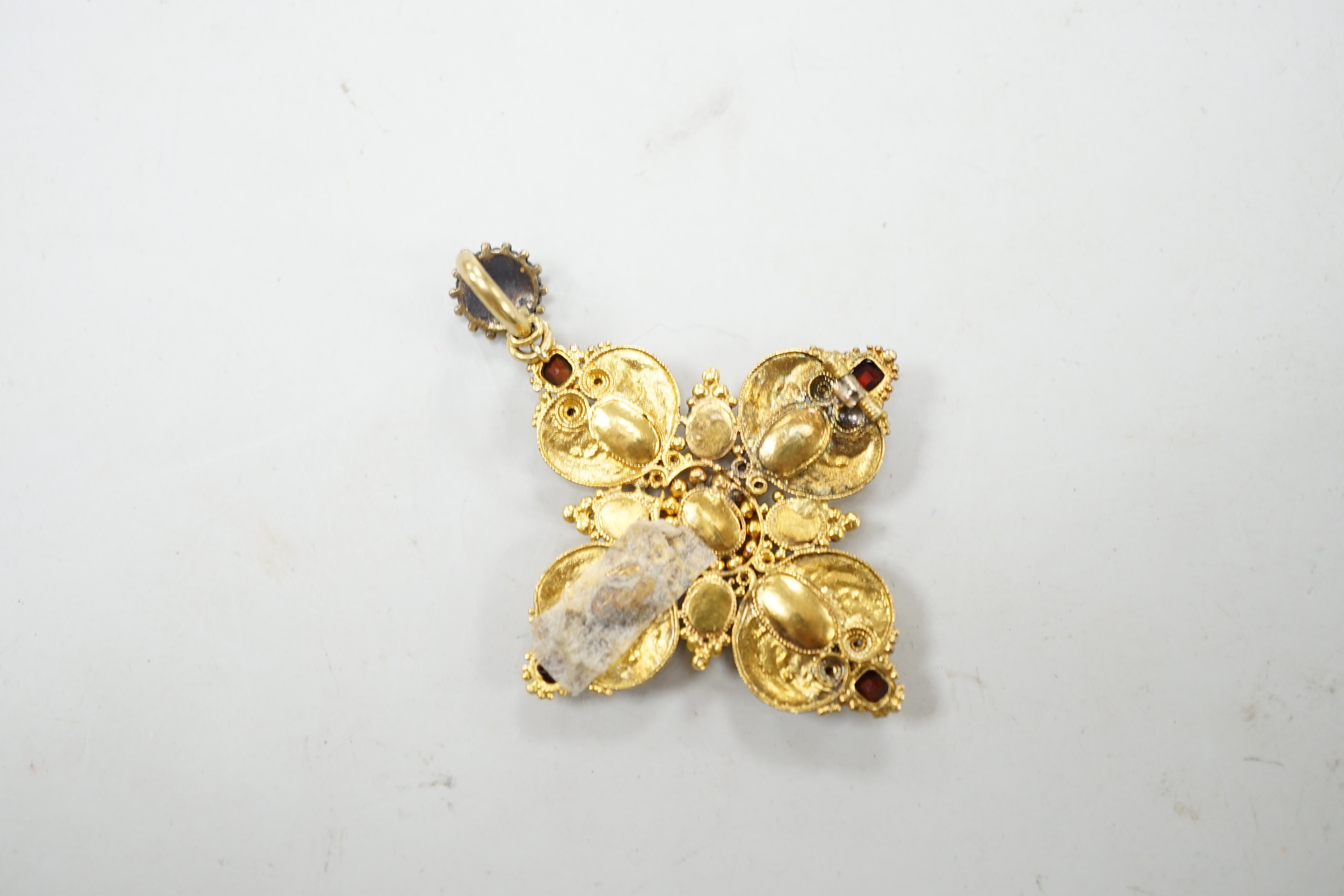 A 19th century yellow metal, turquoise, split pearl and garnet set quatrefoil pendant, overall 5cm, gross weight 7.5 grams.